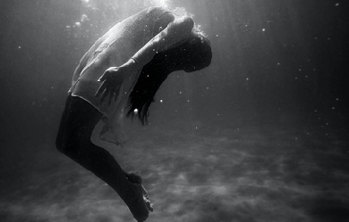 Black and white photo of young girl drowning