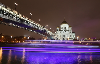 Bridge to the church over purple lights